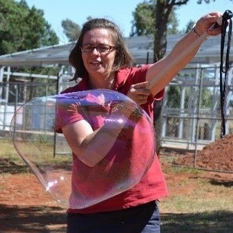 Educator making a very large bubble